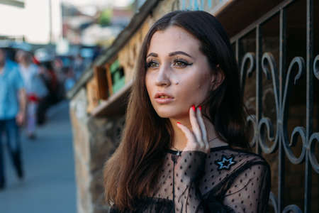 Emotional portrait of Fashion stylish portrait of pretty young woman. city portrait. sad girl....