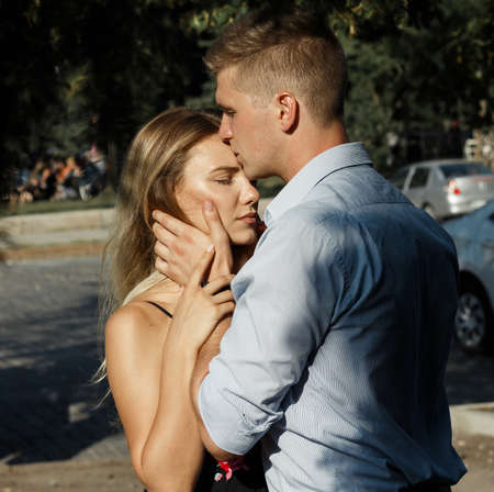 happy couple in love hugging and holding hands, summer date