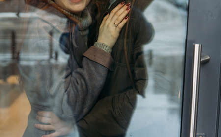 couple hugs. A female hand with a ring lies on the chest of a man. a man hugs his wife's waist....