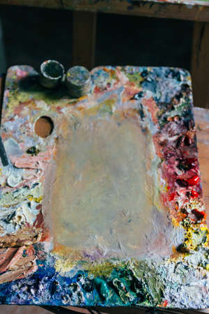 a palette with oil paints. room artist. artist's workshop. hobby.の写真素材