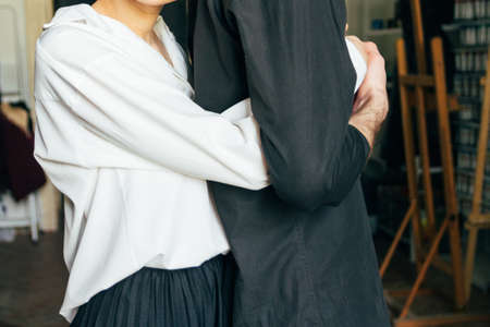 holding hands. Lovers couple holding hands in a room. Hand in hand.hugの写真素材