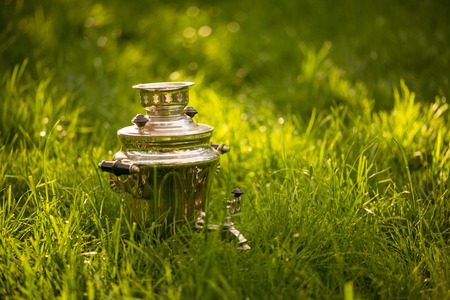 Rustic samovar on the fresh summer lawn.の写真素材