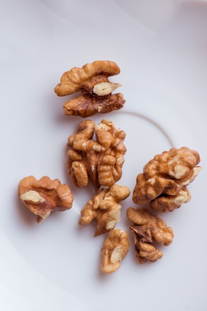 Close-up walnut on a white background. Macro shotの写真素材