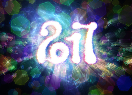 Happy new year 2017 isolated numbers written with light on bright polygonal bokeh background full of flying digits.の写真素材