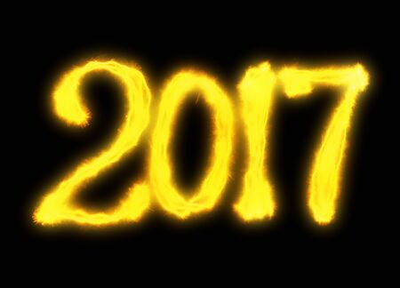 Happy new year 2017 isolated numbers lettering written with fire flame or smoke on black background.の写真素材