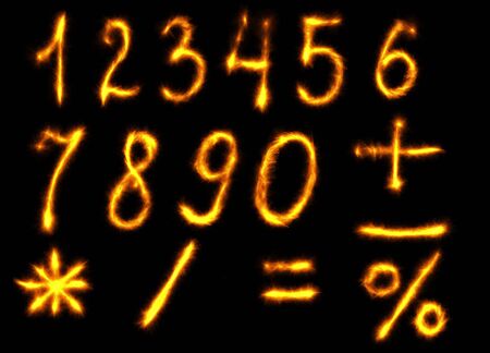 The fire numbers set collection alphabet on black background.の写真素材