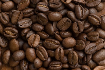 Brown coffee beans, closeup macro for background and texture