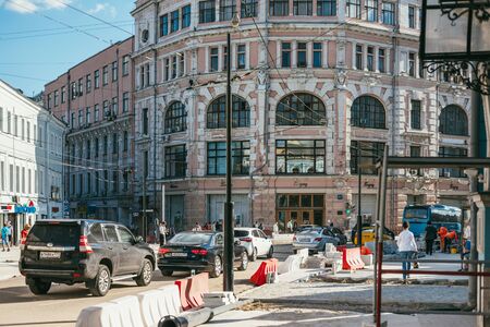 MOSCOW, RUSSIA - AUGUST 14, 2015. workers lay tiles road pavement on Myasnitskaya street 8-2のeditorial素材