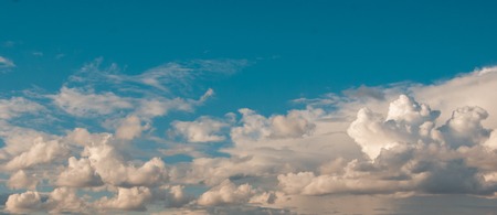 Natural background of colorful sky full of fluffy clouds during sunset time