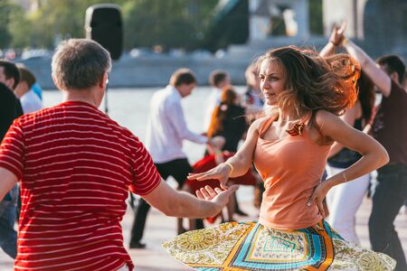 MOSCOW, RUSSIA-MAY 09, 2015: people are dancing outdoors in the Park on Pushkinskaya embankment at...