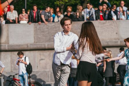 MOSCOW, RUSSIA-MAY 09, 2015: people are dancing outdoors in the Park on Pushkinskaya embankment at...