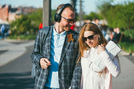 Moscow, Russia - may 9, 2018. A young man with a St. George ribbon on his lapel walks with a girl in the Park. May 9-victory day in the great Patriotic warのeditorial素材