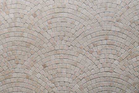 Beige mosaic tile texture on the bathroom wall.の写真素材