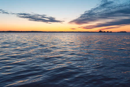 Evening sea sunset landscape where the sea occupies more space in the frame. Copyspace for your textの写真素材