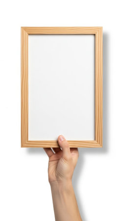 Hand holding empty picture frame isolated on white backgroundの素材