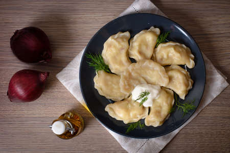 Dumplings with meat cherries vegetables cabbage pork turkey beef. A traditional Russian dish. Delicious and healthy breakfast.の写真素材