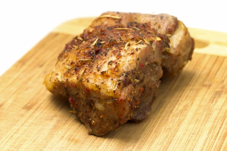 Piece of Baked Spicy Meat on Wooden Cutting Boardの写真素材