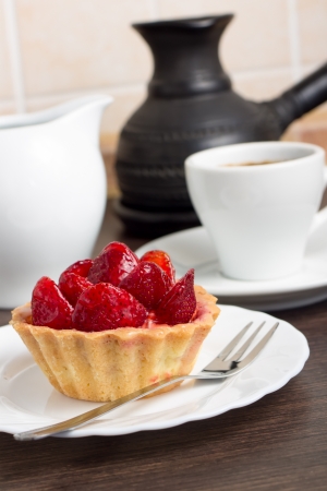 Strawberry Dessert with Cup of Coffee at the Kitchen Tableの写真素材
