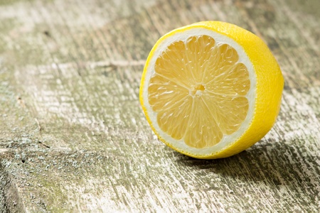 Lemon at old wood backgroundの写真素材