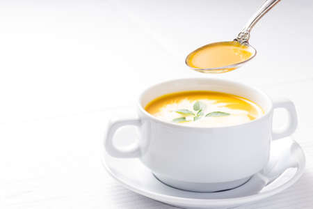 Pumpkin soup on served tableの写真素材