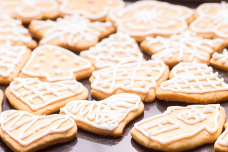 Gingerbread iced cookies on tableの写真素材