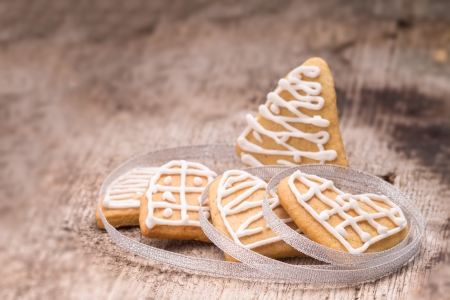 Christmas decoration. Gingerbread cookies on wood background. Selective focusの写真素材