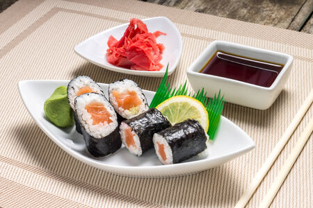 Traditional Maki sushi served with wasabi and gingerの写真素材