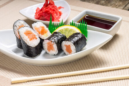 Traditional Maki sushi served with wasabi and gingerの写真素材