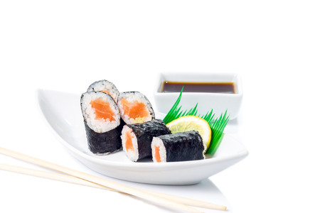 Seafood Maki sushi in white plate isolated on white backgroundの写真素材