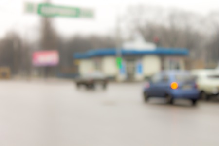 Unfocused image of city traffic. Blurred townの写真素材