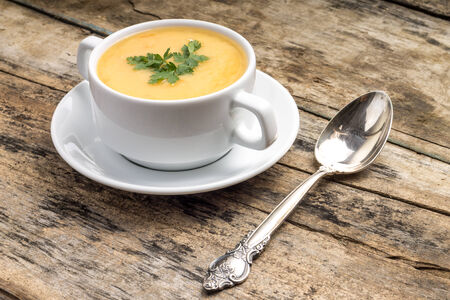 Vegetarian food. Pea soup with silver spoonの写真素材