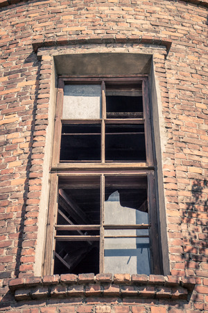 High window in old brick buildingの写真素材