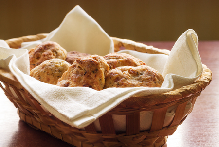 Homemade scones in a wicker basketの写真素材