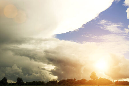 Coming storm during sundown or sunrise in countryside. Natural phenomenon.の写真素材