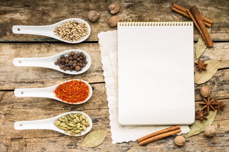 Menu background. Recipe notepad with diversity of spices and herb.の写真素材