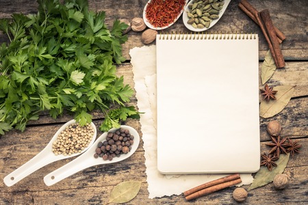 Menu background. Cook book toned image. Vintage image of recipe bacRecipe notepad with diversity of spices and herb.の写真素材