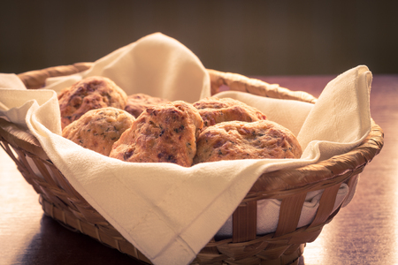 Homemade scones in a wicker basketの写真素材