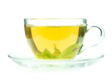 Glass cup of fresh green tea isollated on white backgroundの写真素材