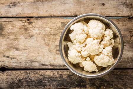 Vegetarian recipe or menu background with copy space. Cauliflower in a bowlの写真素材