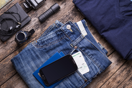 Travel stuff with smartphone and smartwatch with empty screen. Mock up mobile smart wearable device for tourismの写真素材