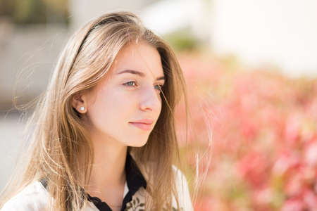 Young beautiful caucasian girl with long hair dreamy looking with copy spaceの写真素材