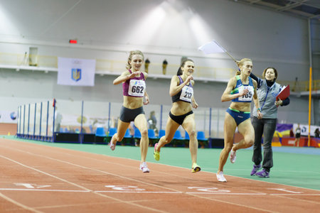 SUMY, UKRAINE - FEBRUARY 17, 2017: finish of 3000m race on Ukrainian indoor track and field championship 2017. Viktoria Khapilina gets gold and Mariya Shatalova gets silver medal.のeditorial素材