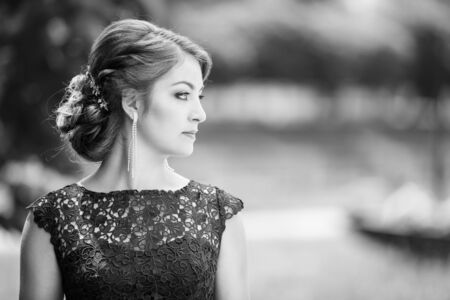 Outdoor portrait of young elegant lady in dressの写真素材