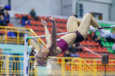SUMY, UKRAINE - FEBRUARY 9, 2018: MAKSIMOVA Yana performing high jump in pentathlon of Ukrainian indoor track and field championship 2018のeditorial素材