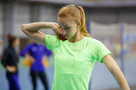 SUMY, UKRAINE - FEBRUARY 9, 2018: Hanna Nelepa - performing shot put in pentathlon competition on Ukrainian indoor track and field championship 2018 performing high jumpのeditorial素材