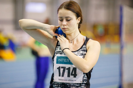 SUMY, UKRAINE - FEBRUARY 9, 2018: KOBYLKA Anastasiya performing shot put attempt in pentathlon competition on Ukrainian indoor track and field championship 2018のeditorial素材