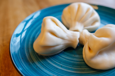 Khinkali with cheese on the plate in restaurantの写真素材