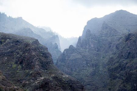 Mystical foggy ravine of Barranco del Infernoの写真素材