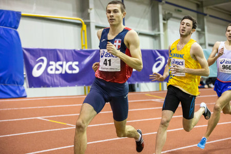 SUMY, UKRAINE - FEBRUARY 20, 2020: Yevhen Hutsol champion on 800m distance on Ukrainian indoor track and field championship 2020.のeditorial素材