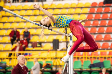 SUMY, UKRAINE - FEBRUARY 21, 2020: pentathlon sportswoman flying in high jump attempt at Ukrainian...